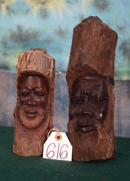 Two African Men Carved on Tree Branches