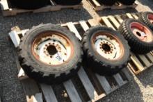 TWO TITAN 25X8.50-14 TIRES WITH 6 BOLT RIMS