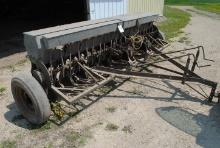 John Deere Van Brunt 12' Double Disc Drill with Grass Seeder, stored inside.