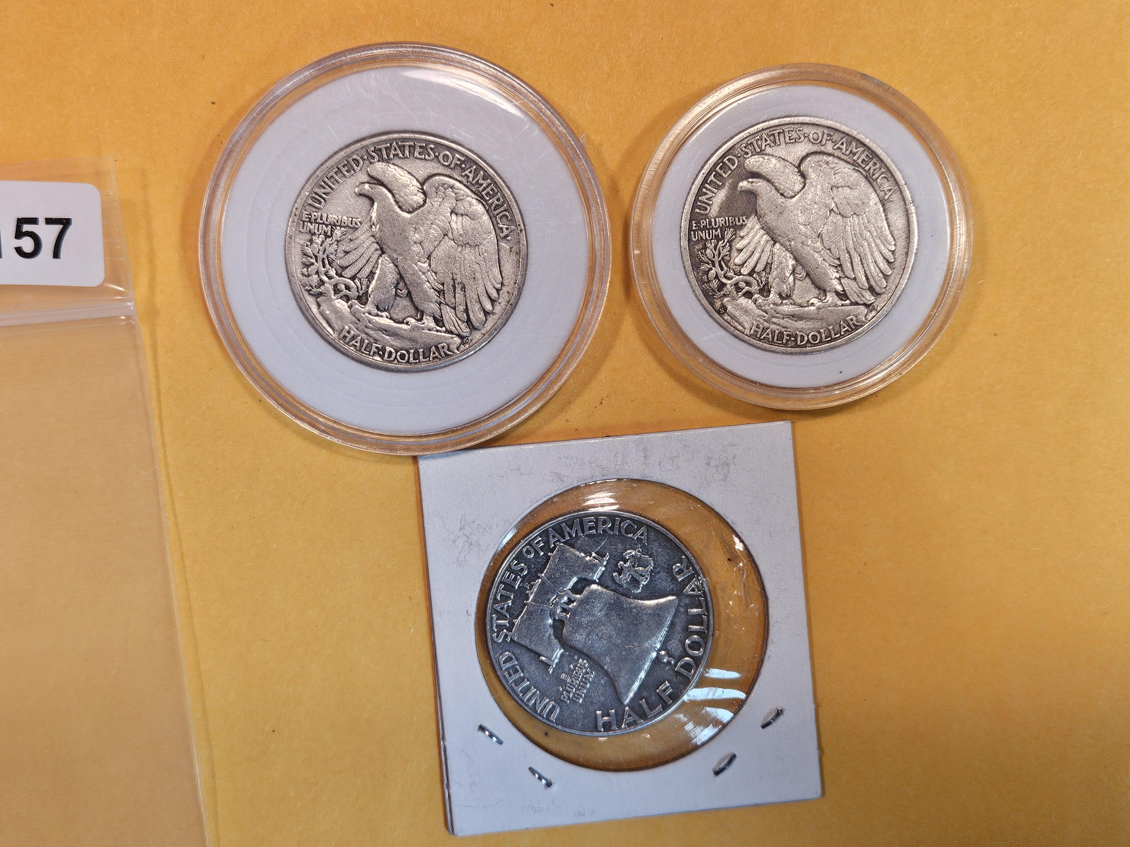 Three mixed silver half dollars