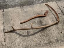 Wood handled scythe and iron pump handle