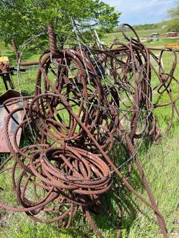 Rusty cables with loops on the end. Rack is included