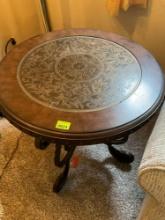 Round End table. 24 by 25 inches