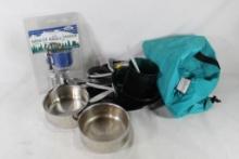 Two nylon bags with cooking pots and pans, and one camping mini espresso maker, in package.