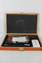 Wood box of rifle and pistol cleaning kit. Looks like new.