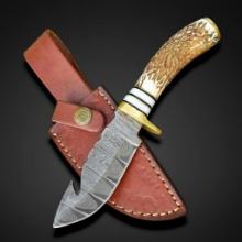 Damascus Hunting Knife with Unique Blade Cut and Camel Bone Handle. Has 6" blade and leather sheath.