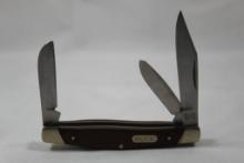 Buck model 371 three blade stockman with 2.75 inch main blade. Wood scales. Excellent condition.