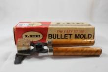 One Lee wood handle single cavity bullet mold 100 gr .311. Used, in box.
