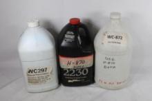 Three gallon jugs of reloading powder. One labeled WC872, full, one labeled H-870, full and one
