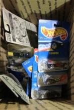 Box of 25 Hot-Wheels cars, in packages.