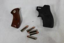 One wood Charter Arms small pistol grips, one CTG monogrip with laser and 5 Hornady 32 H&R Mag FTX