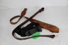 Three rifle slings. One black nylon and two leather, one is padded Cobra. Used.