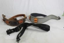 Two leather Cobra rifle slings with attachment.