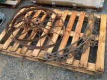 CAST IRON DECORATIVE PIECE AND TWO WAGON WHEELS