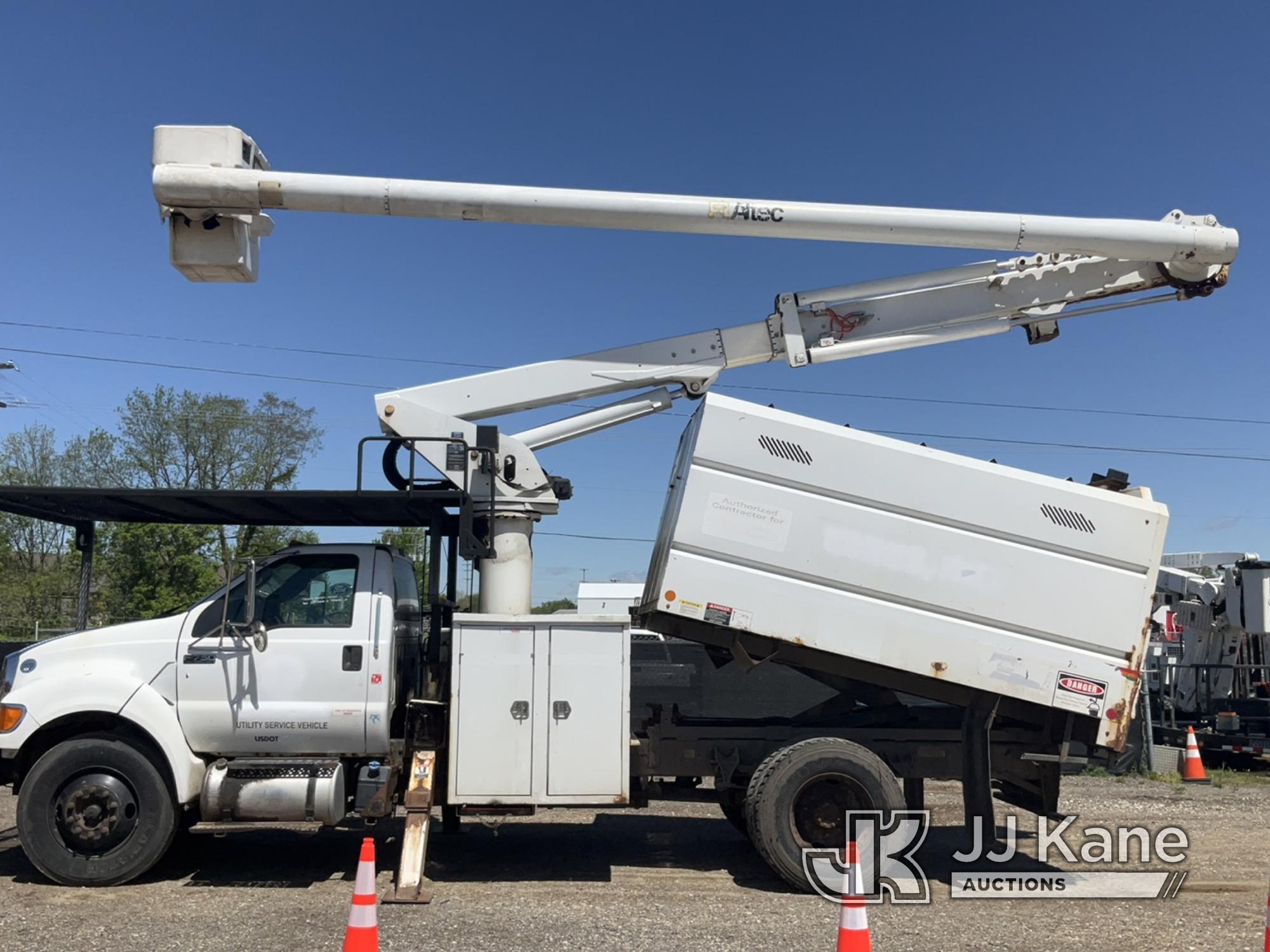 (Charlotte, MI) Altec LR756, Over-Center Bucket Truck mounted behind cab on 2013 Ford F750 Chipper D