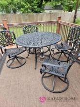 Patio table with four chairs and umbrella holder