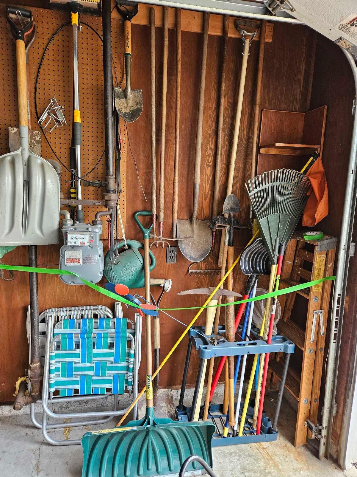 Yard tool lot including ladder