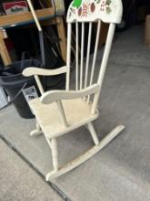 child's rocker with music box on bottom