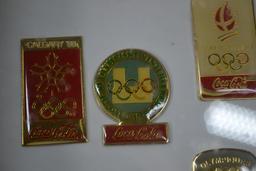 Group of Olympic Coca-Cola Pins Collection Containing Years 52, 68, 72, 82, 88, 92; In Mounted Shado