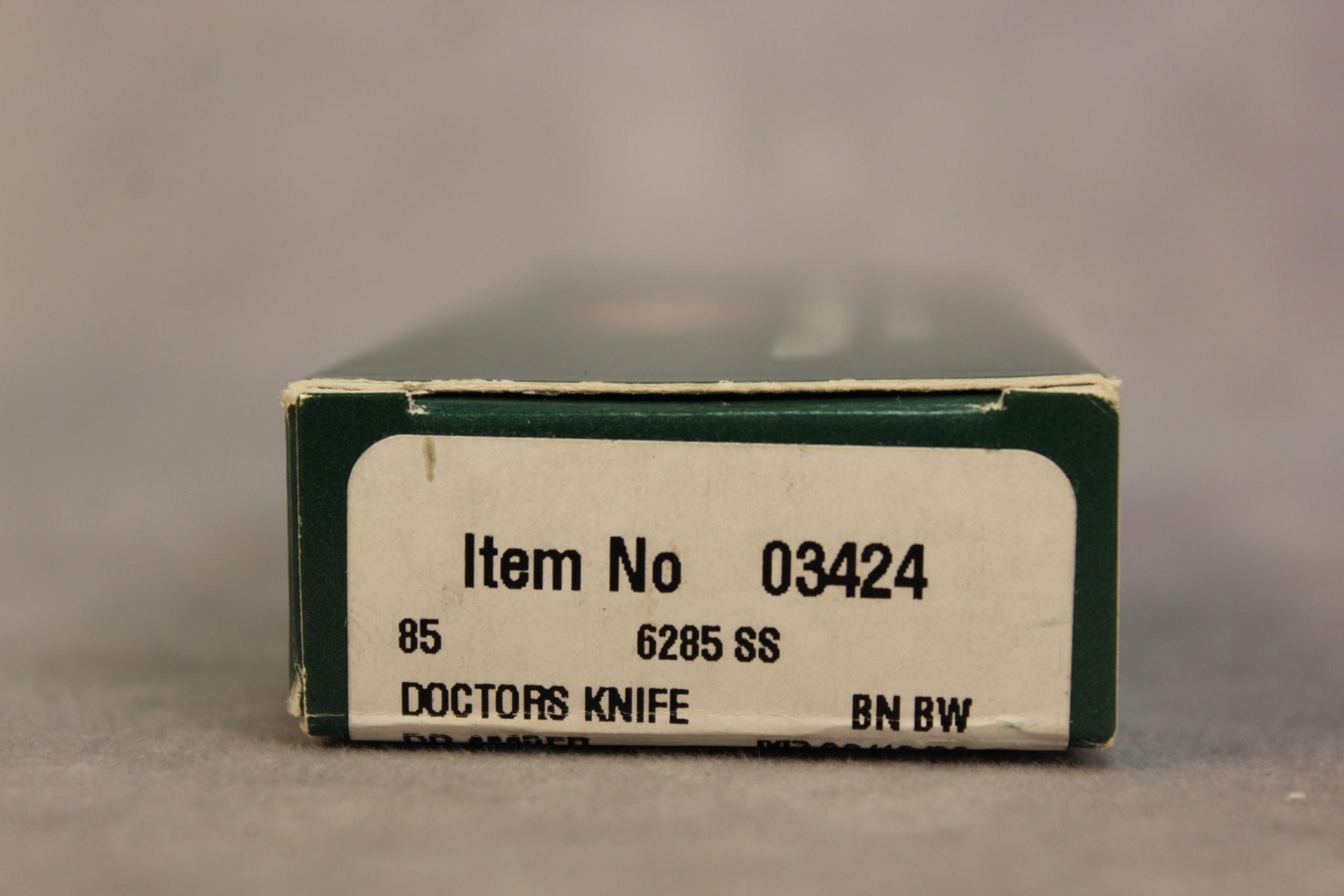 2002 DRK AMBER BONE DR. KNIFE. 6285 SS