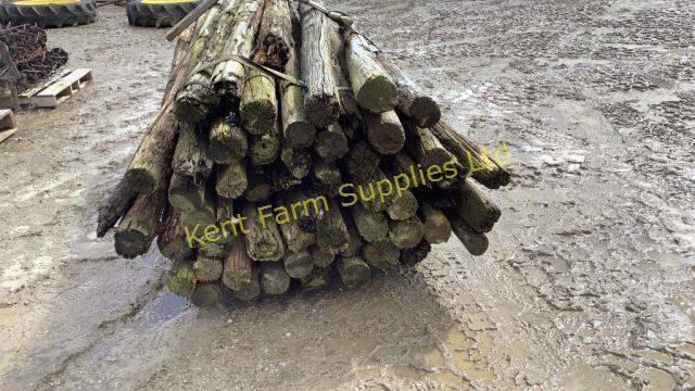 SKID OF 8 FEET LONG ANTIQUE WOODEN FENCE POSTS