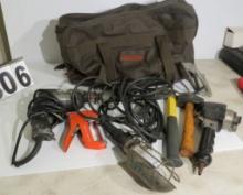 leather contractor bag with mixed tools - drill motor, impact driver, staple gun, trouble light hamm