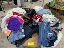 Table Lot Childrens Clothing / Ladies Clothing & More - Please see pics for additional specs.