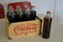 Coke bottles in wood box