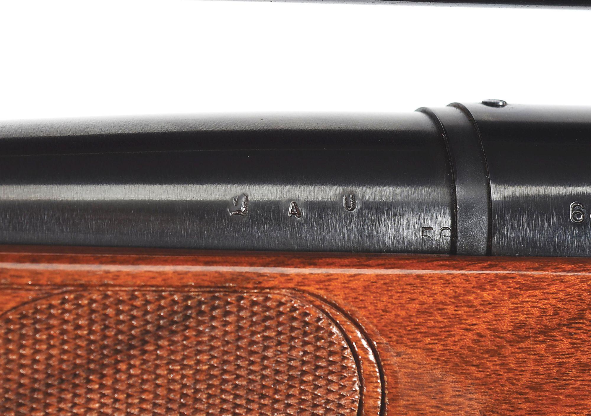 (C) REMINGTON MODEL 700 VARMINT SPECIAL BOLT ACTION RIFLE IN .222 WITH LYMAN OPTIC.