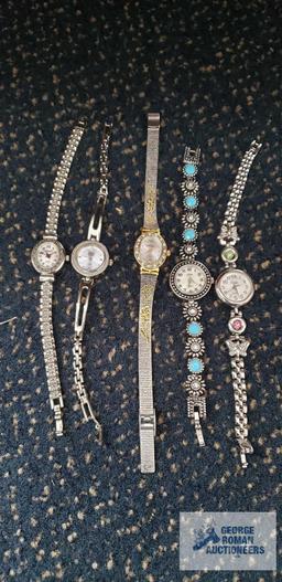 Five watches including Vivani, Collezio, Times Square, Faded Glory, and Sasson