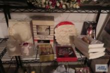Shelf of Christmas decorations and serving plates and ice bucket
