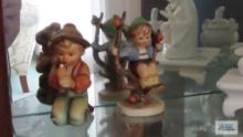 Hummel Apple boy figurine and boy playing instrument figurine, both have chips