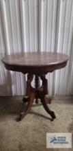 Antique stand with marble top and ornate base. 30 in. tall by 29 in. long by 23 in. wide