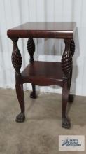 Antique mahogany stand with turned legs and claw feet. 28-1/2 in. tall by 16-1/2 in. square