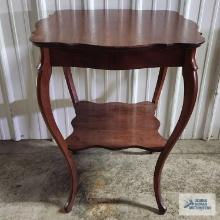 Antique mahogany stand with queen anne legs. 30 in. tall by 2 ft wide