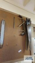 Lot of hand saws, chainsaw bar with chain and face shield