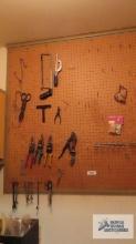 Tin snips, wrenches, saws and etc on pegboard