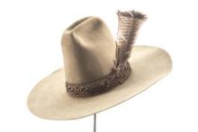 Vintage Felt Western Hat with 8" crown, 4 3/4" brim, with turkey feather in hat band.