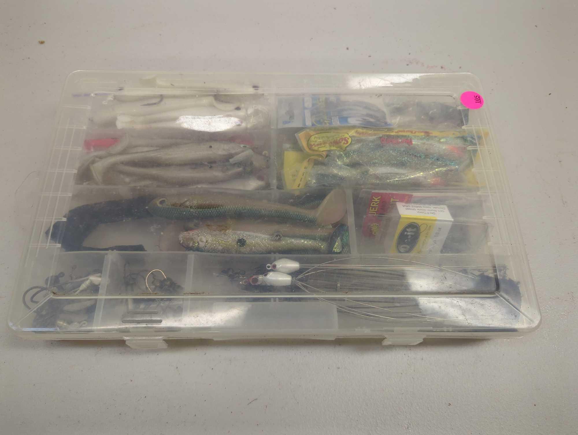 Tackle Box and contents including various fishing lures and other fishing accessories. Comes as is