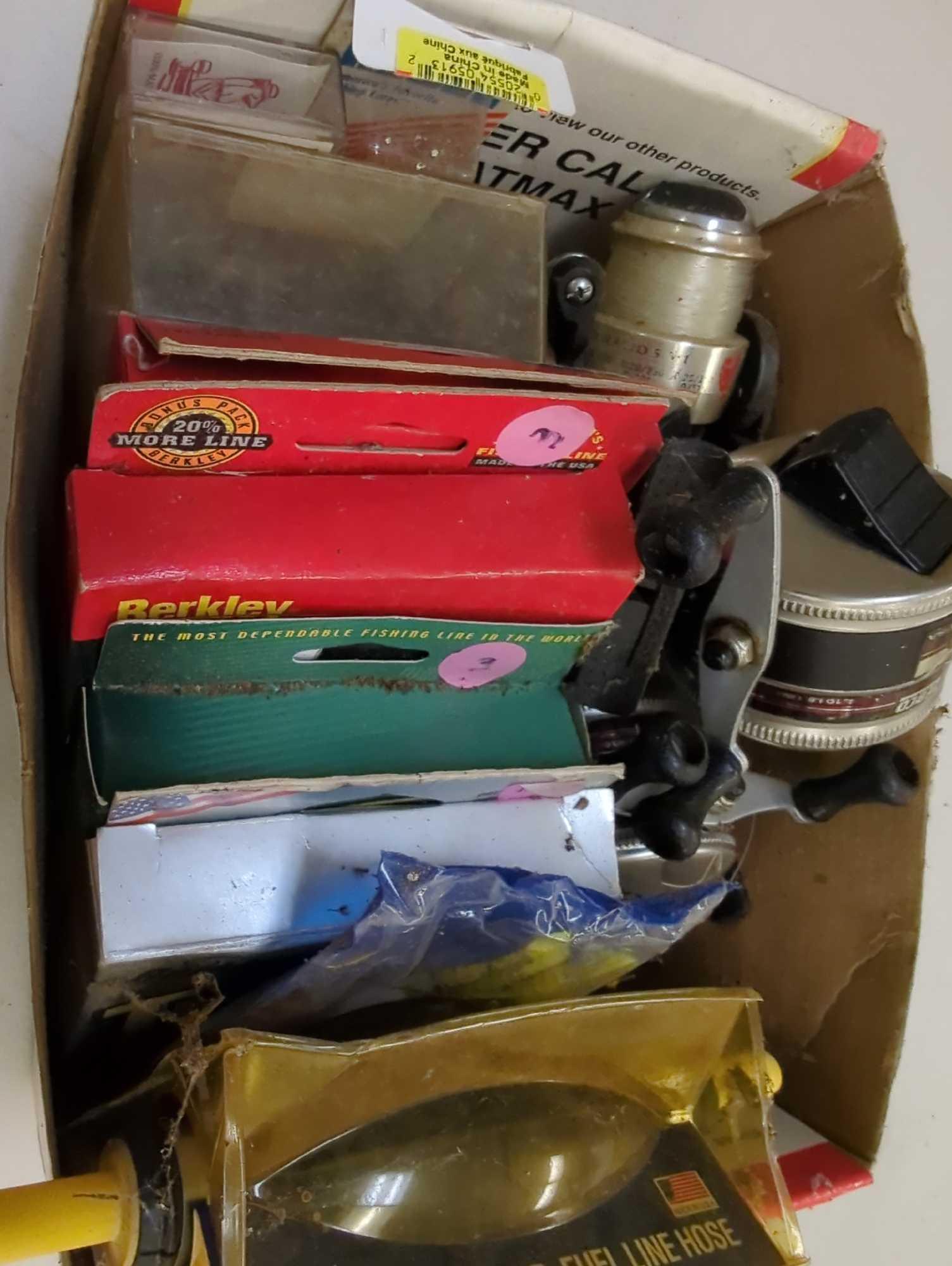 Box of fishing, reels, weights, and other fishing accessories. Comes as is shown in photos. Appears