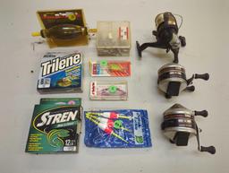 Box of fishing, reels, weights, and other fishing accessories. Comes as is shown in photos. Appears