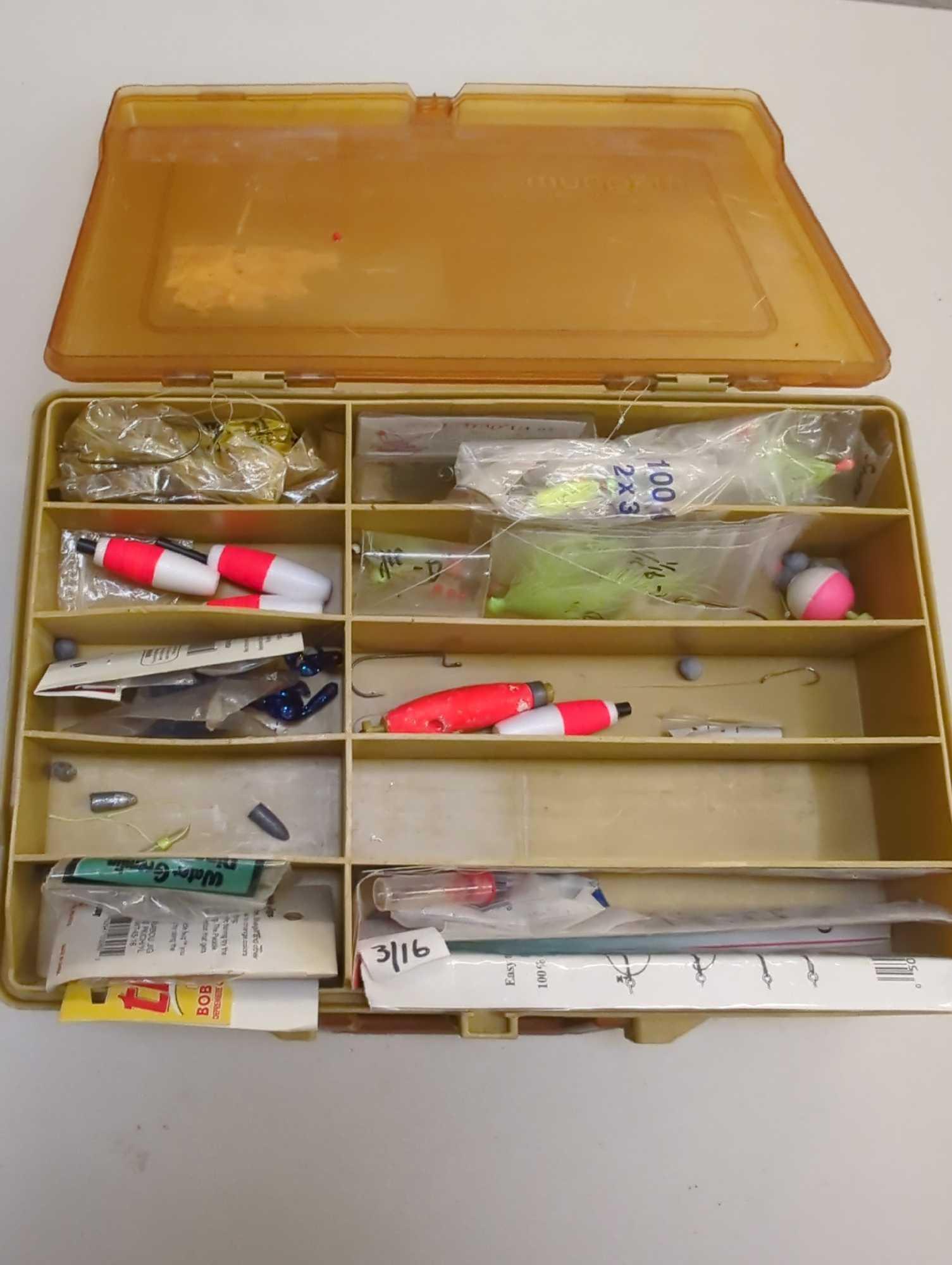 Dual-sided Tackle Box and contents including various fishing lures and other fishing accessories.