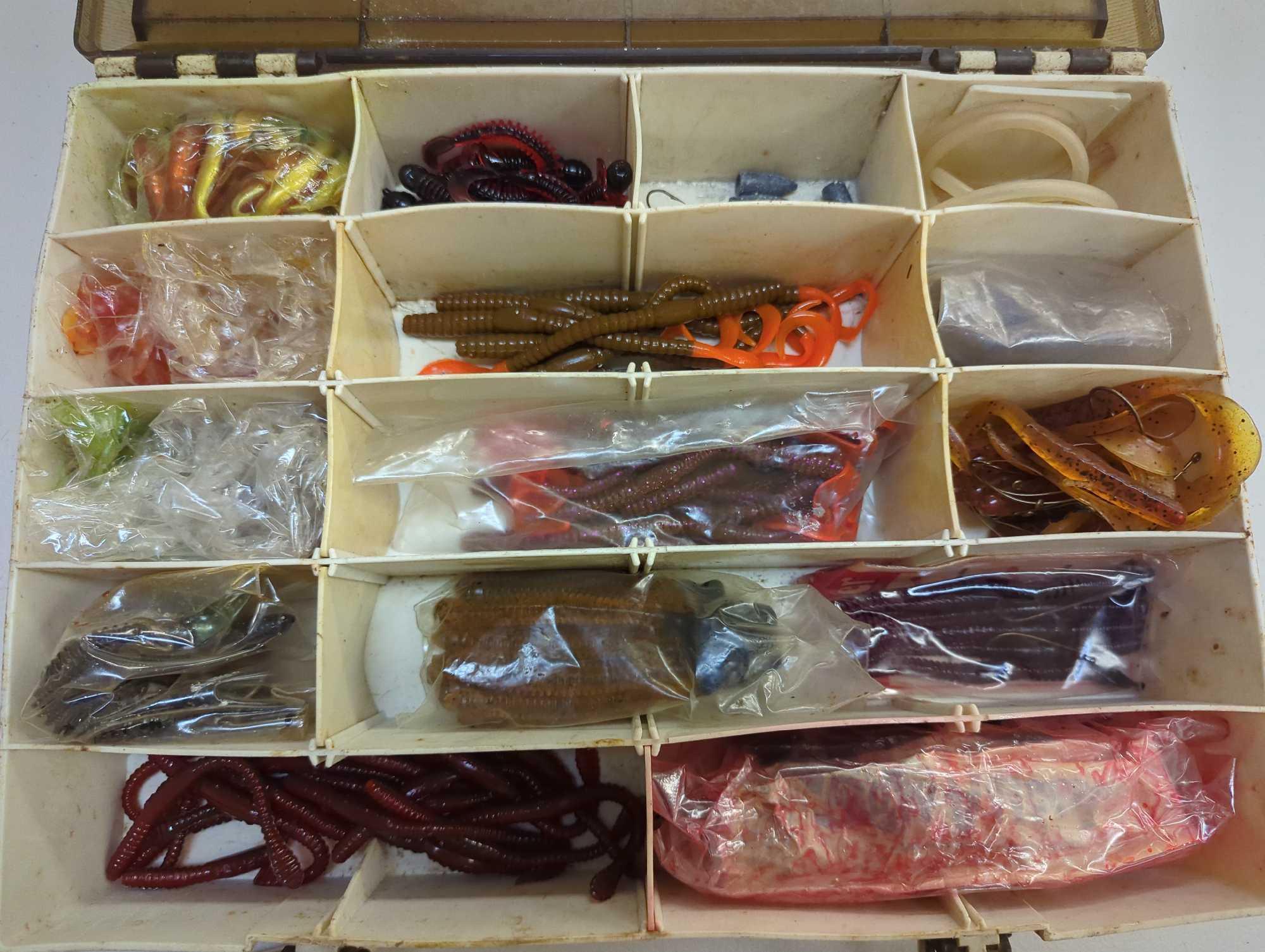Tackle Box and contents including worms and various fishing lures. Comes as is shown in photos.