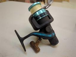 Old Eagle Claw spinning reel, black/blue. Comes as is shown in photos. Appears to be used. Model #