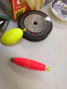 Box of fishing lines and fishing bobbers. Comes as is shown in photos. Appears to be used. 7"W x
