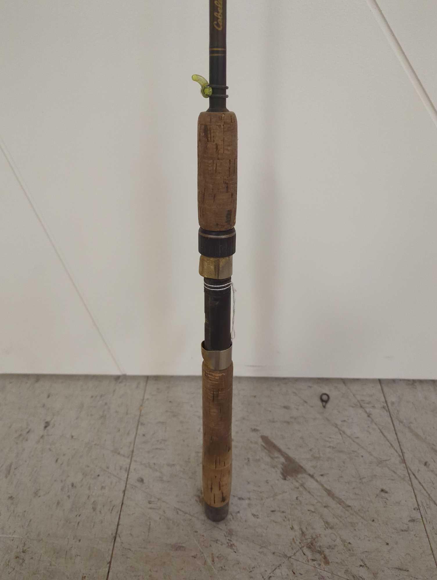 Cabela's 6' fish Eagle graphite fishing rod. Line weight: 6-12 lb Lure weight: 1/4-5/8oz Comes as is