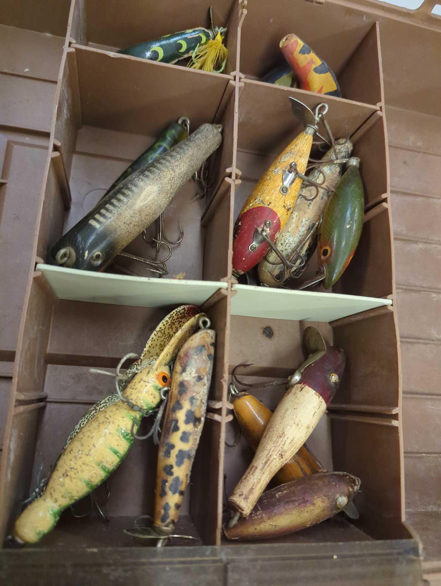 Tackle Box and contents includes Bomber lures and other various lures. Comes as is shown in photos.