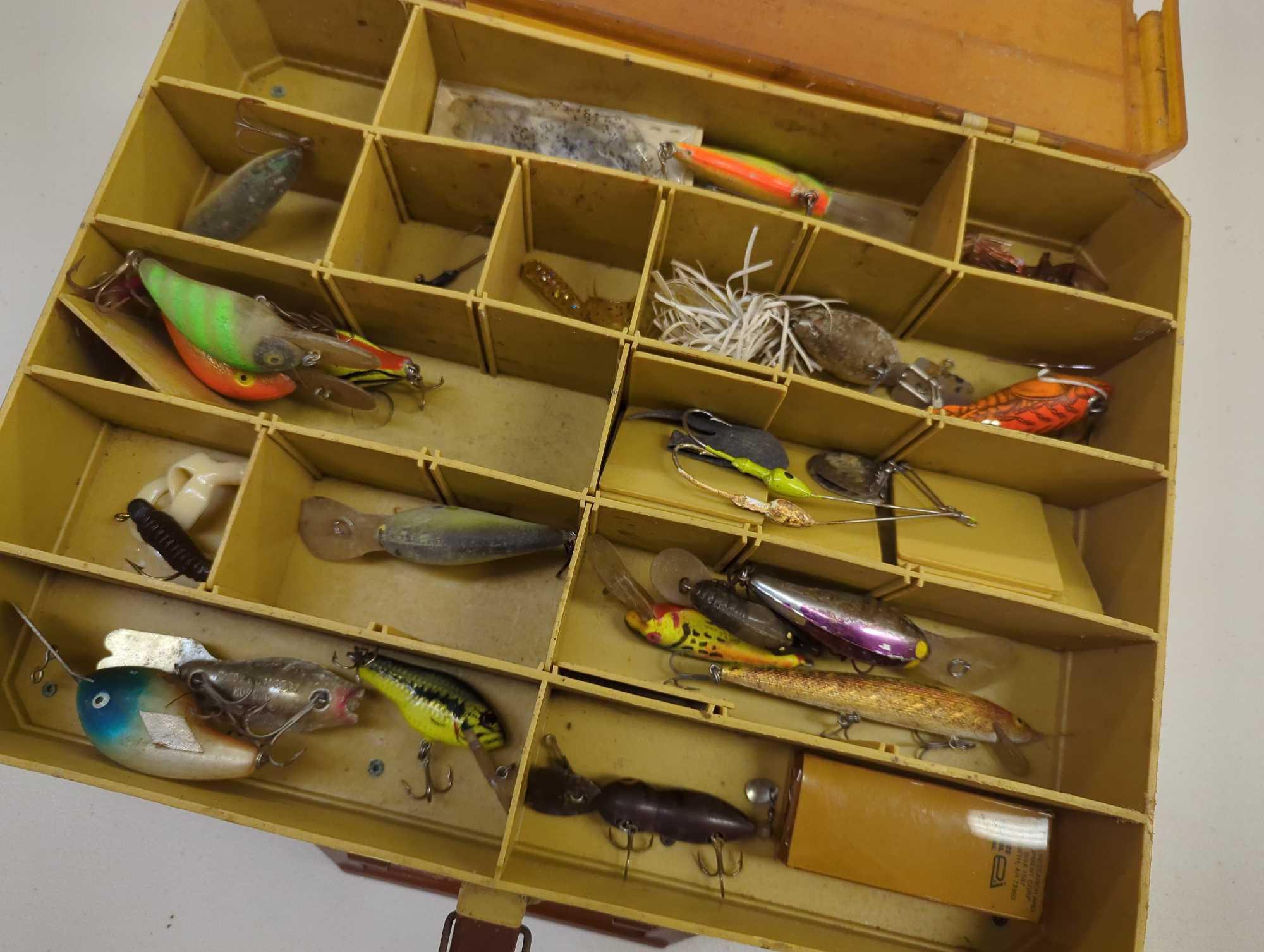 Dual-sided Tackle Box and contents including various fishing lures. Comes as is shown in photos.