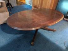 (DBR1) BICENTENNIAL BY DREXEL OVAL WOODEN COFFEE TABLE WITH DUNCAN PHYFE LEGS, CAPPED WITH BRASS. IT