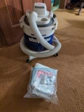 (DR) SHOP VAC BRAND MODEL 600C WET DRY BUCKET VACUUM CLEANER WITH MANUAL AND ATTACHMENT.